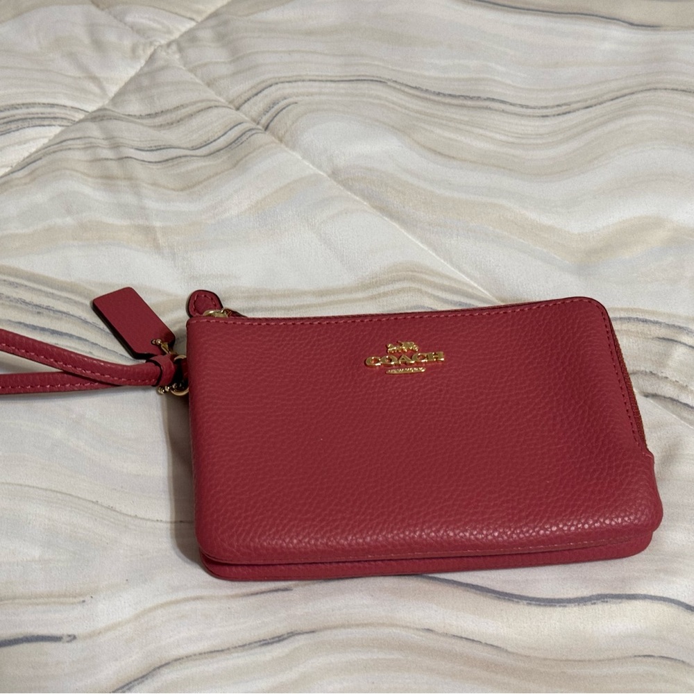 Coach Wristlet with 2 zippered slots. Great shape.